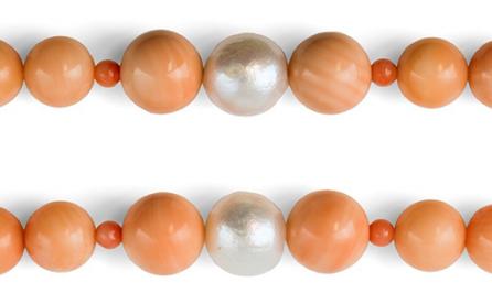 Beads cut from gastropod mollusc shell disguised in a coral necklace